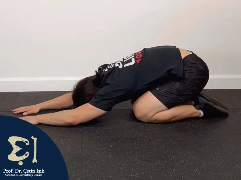 Child's pose exercise to stretch the back muscles